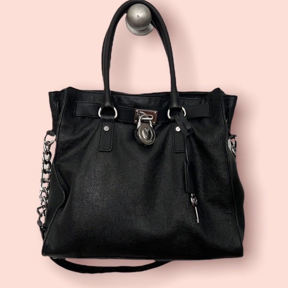 MICHAEL KORS black leather bag.